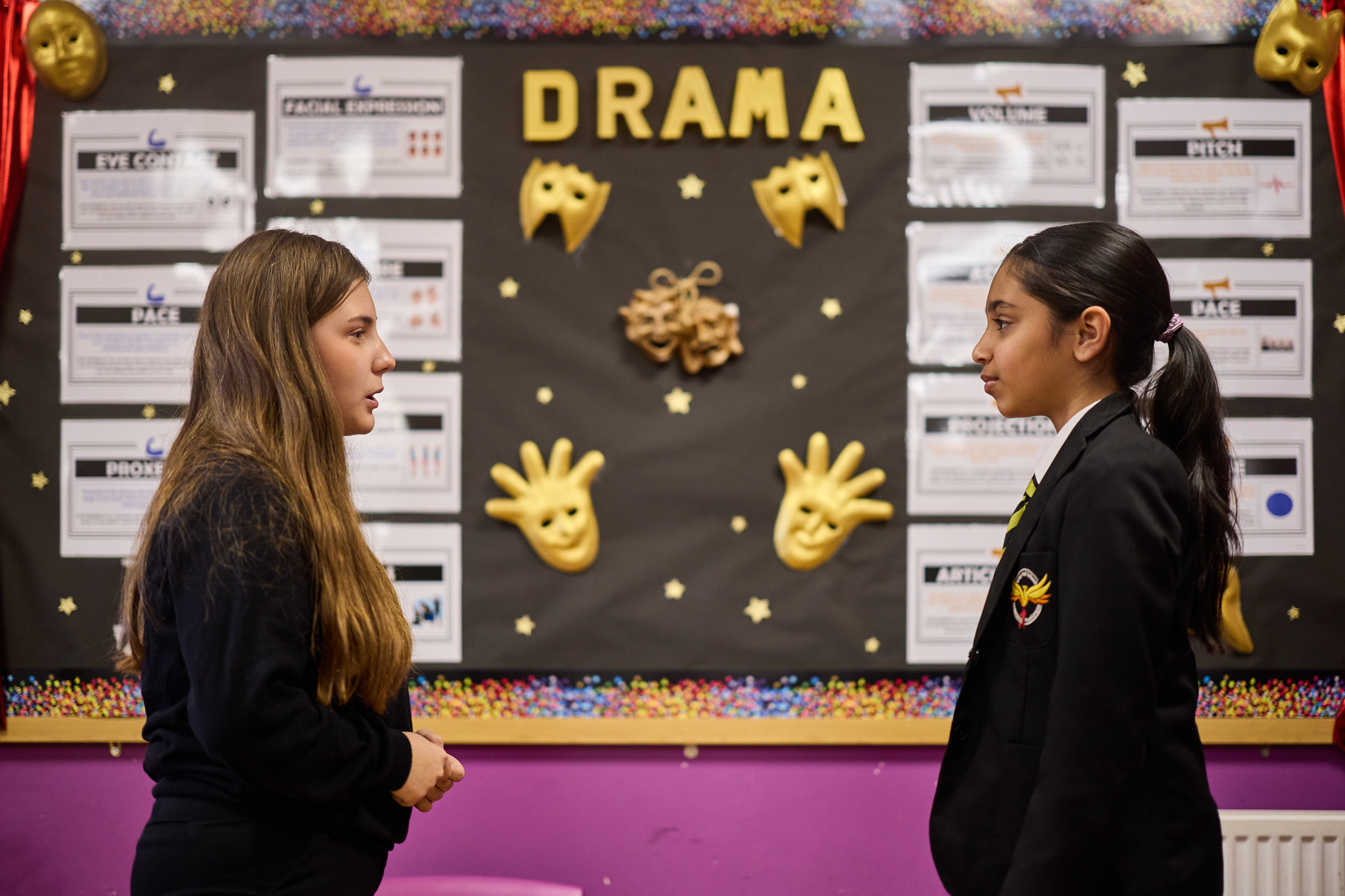 two pupils performing in drama