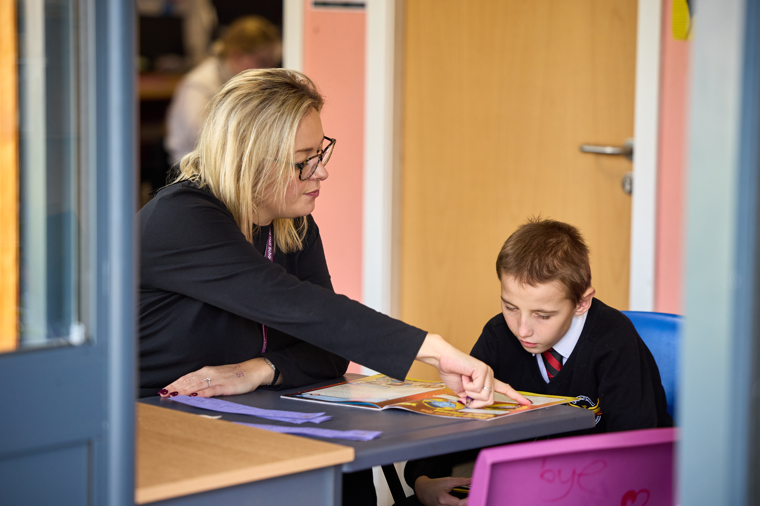 Teacher helping a student