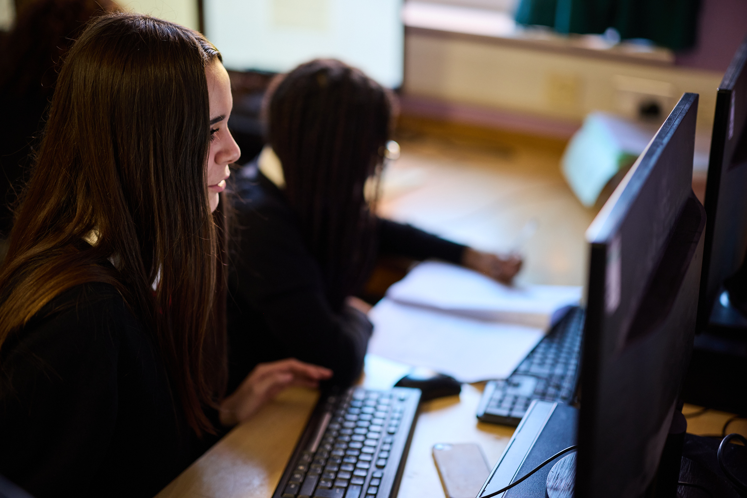 Student logging onto desktop computer