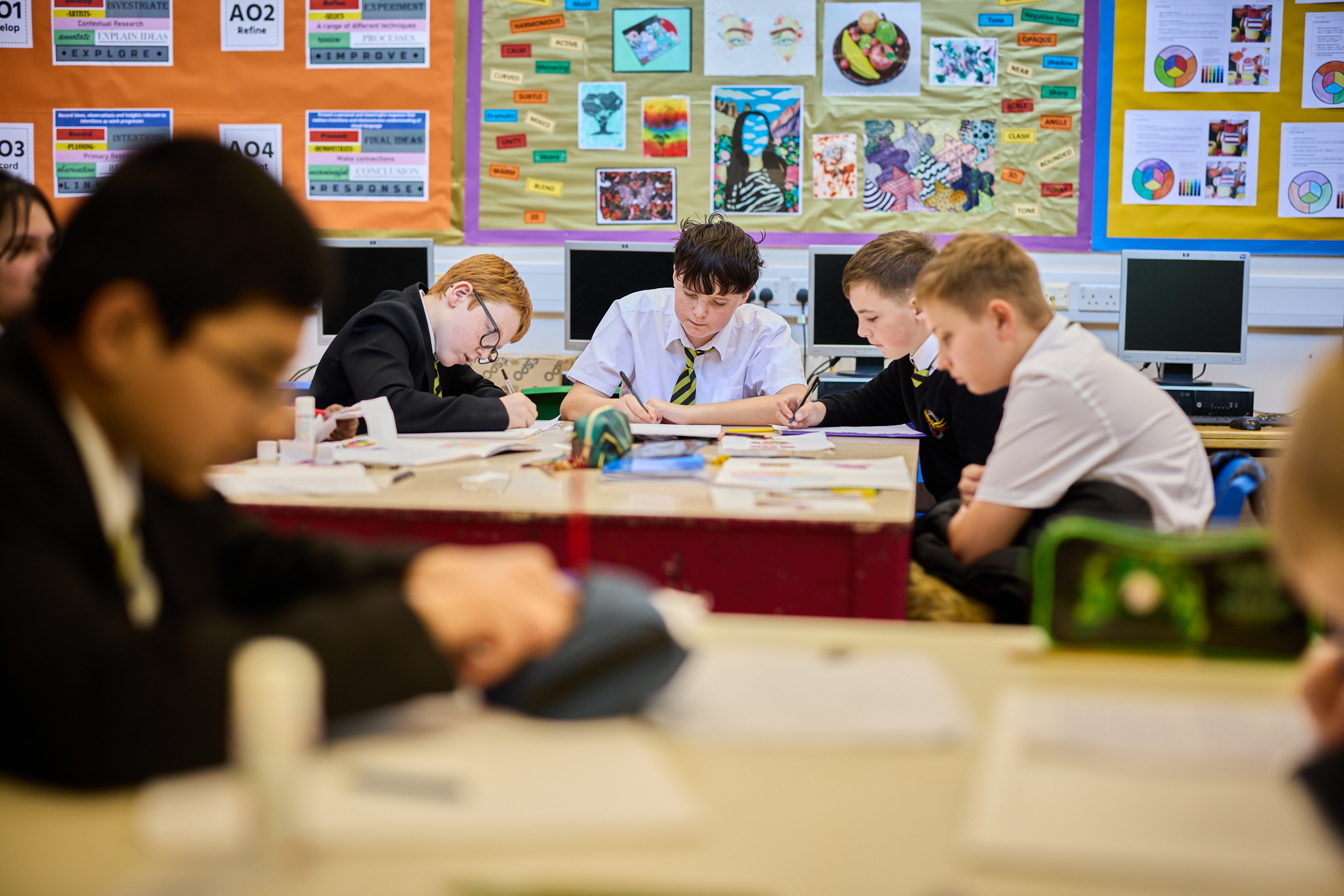 students writing in their books